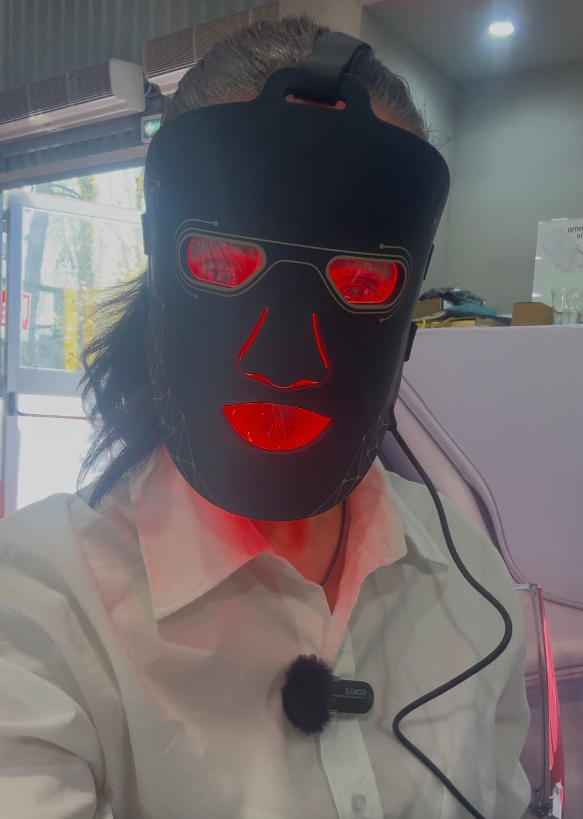 Red light therapy face mask worn on face