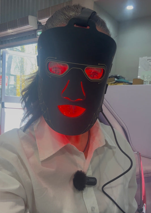 Red light therapy face mask worn on face